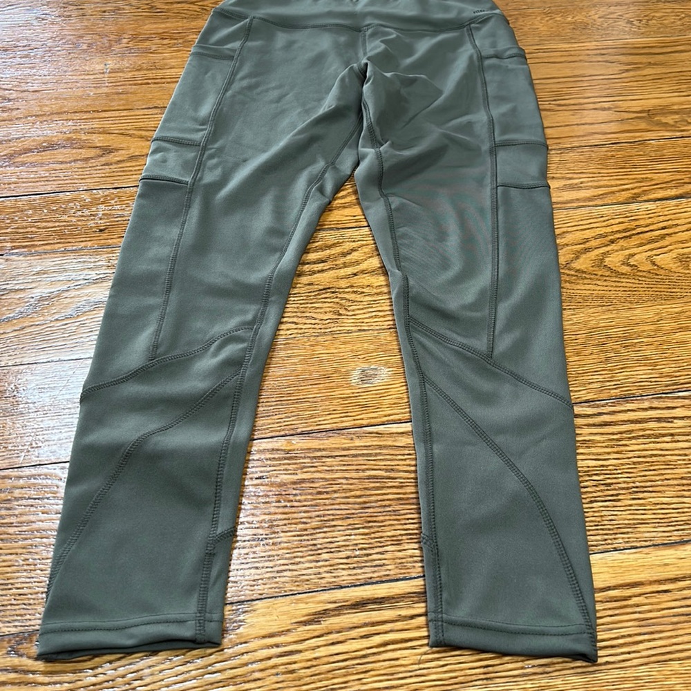 FitKicks olive green compression athletic leggings.  Size Medium (10).
